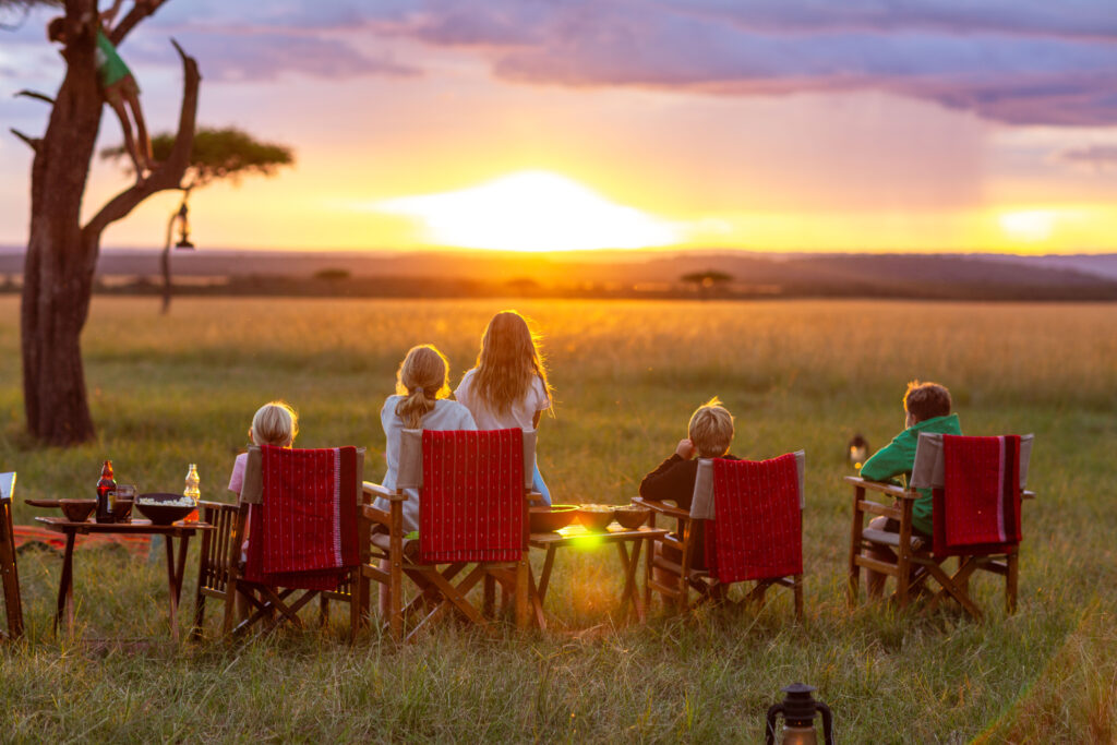 A family enjoying the sunset in the Masai Mara